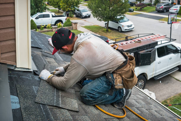 Professional Roofing technician working in Leonard, MI